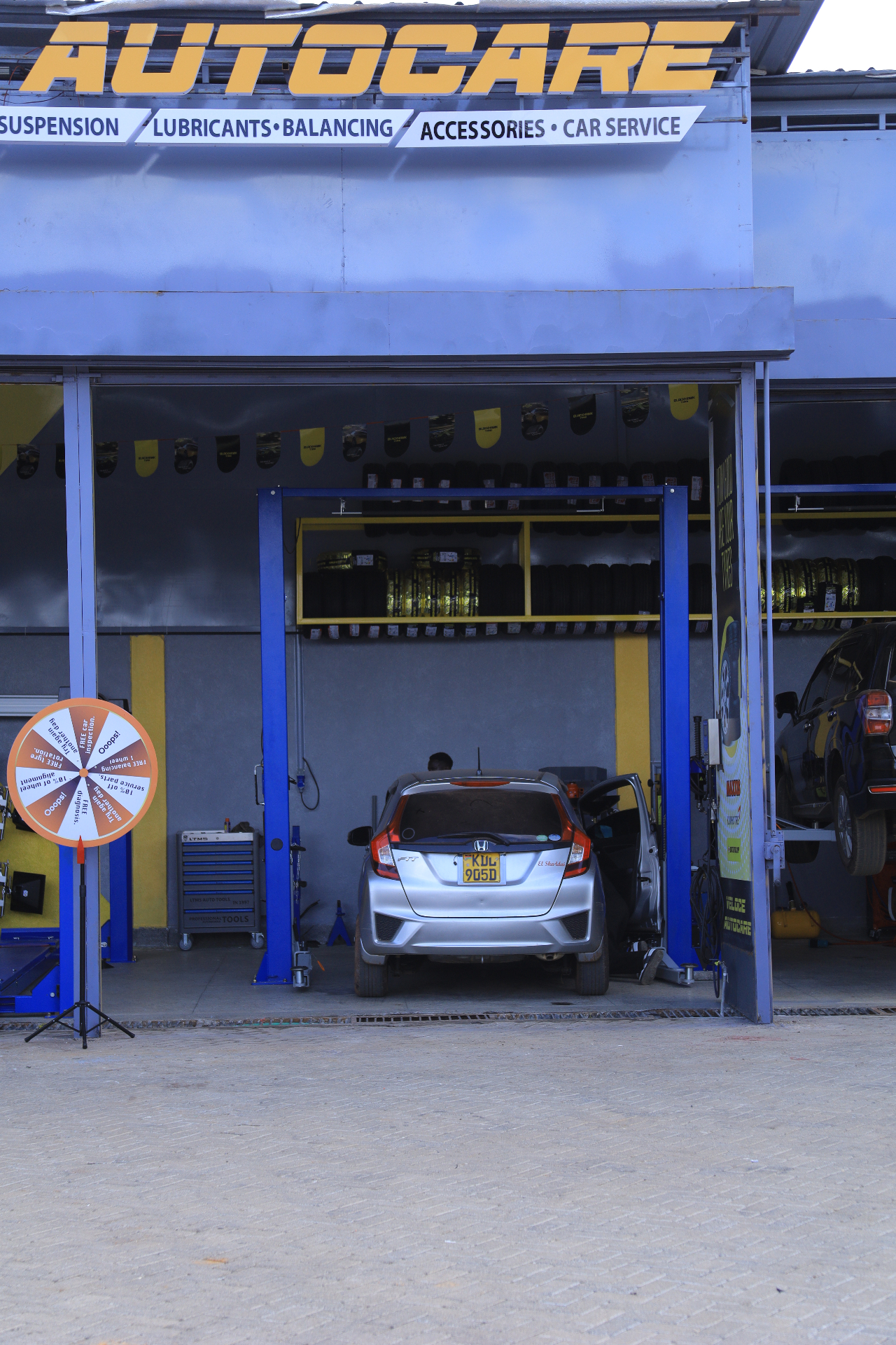 Service bay with car on lift