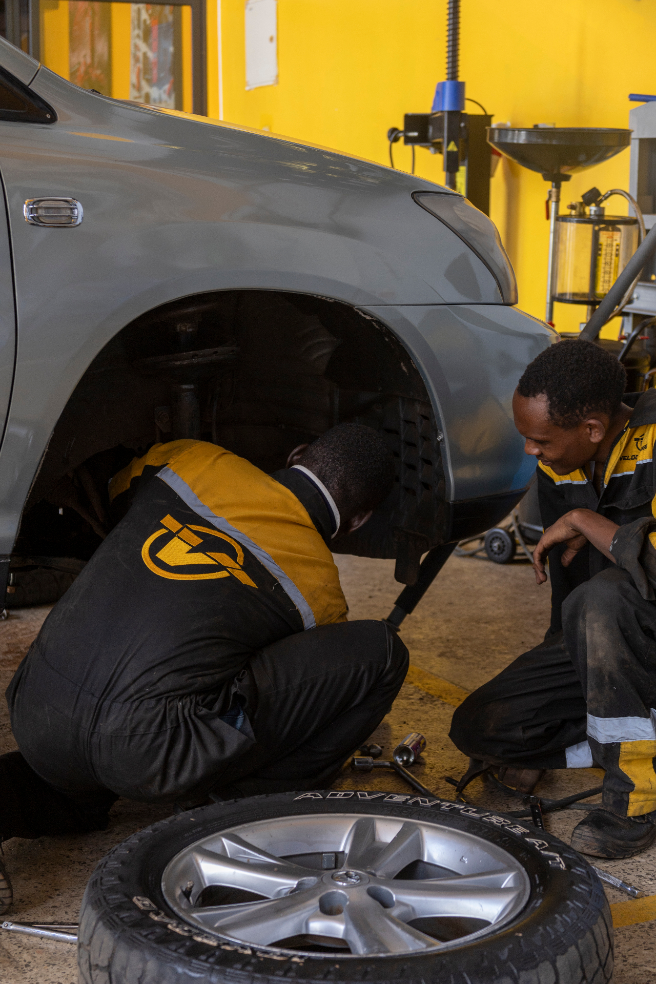 VELOCE technicians servicing a vehicle